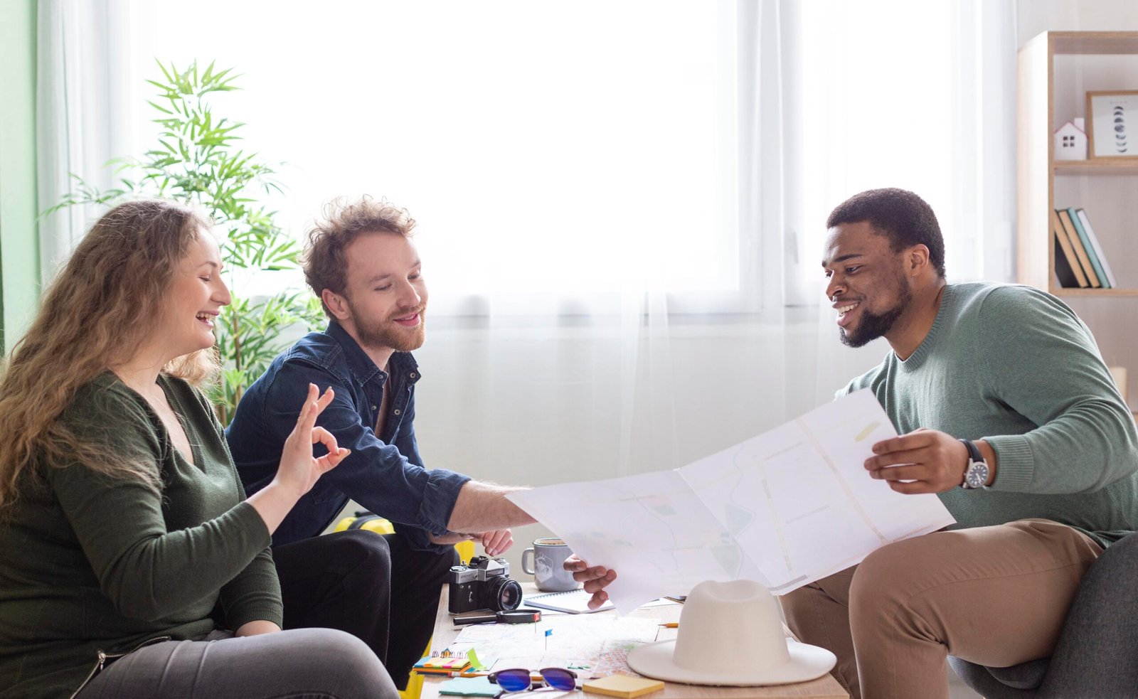 medium shot friends planning trip table